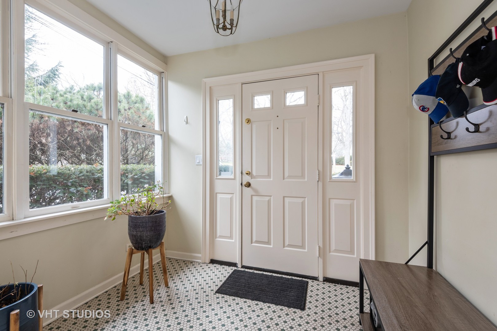 171 Church Road Winnetka, IL 60093 - Photo 3 of 16 a view of a livingroom with lounge chair and a window