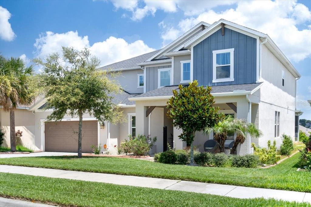 1296 Waterview Ridge Circle Apopka, FL 32703 - Photo 10 of 60 a front view of a house with a yard and garage