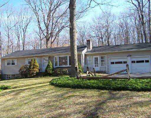 134 Mountain Road Redding, CT 06896 - Photo 1 of 1 front view of a house with a yard
