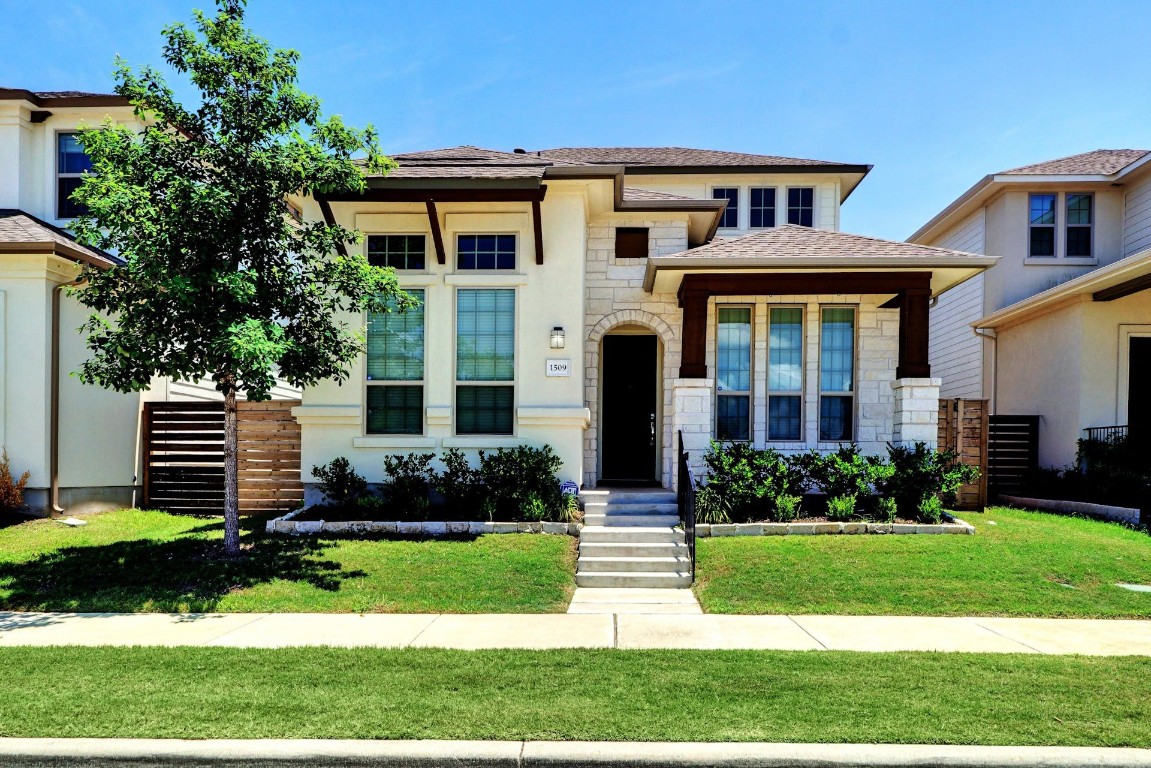 1509 Lawrence Street Austin, TX 78741 - Photo 1 of 1 a front view of a house with a yard