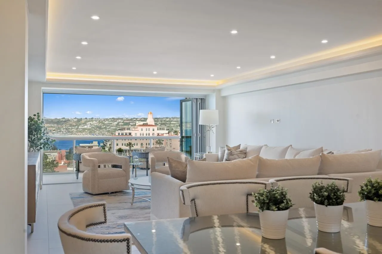 939 Coast La, Unit 16G La Jolla, CA 92037 - Photo 13 of 69 a living room with furniture and a floor to ceiling window