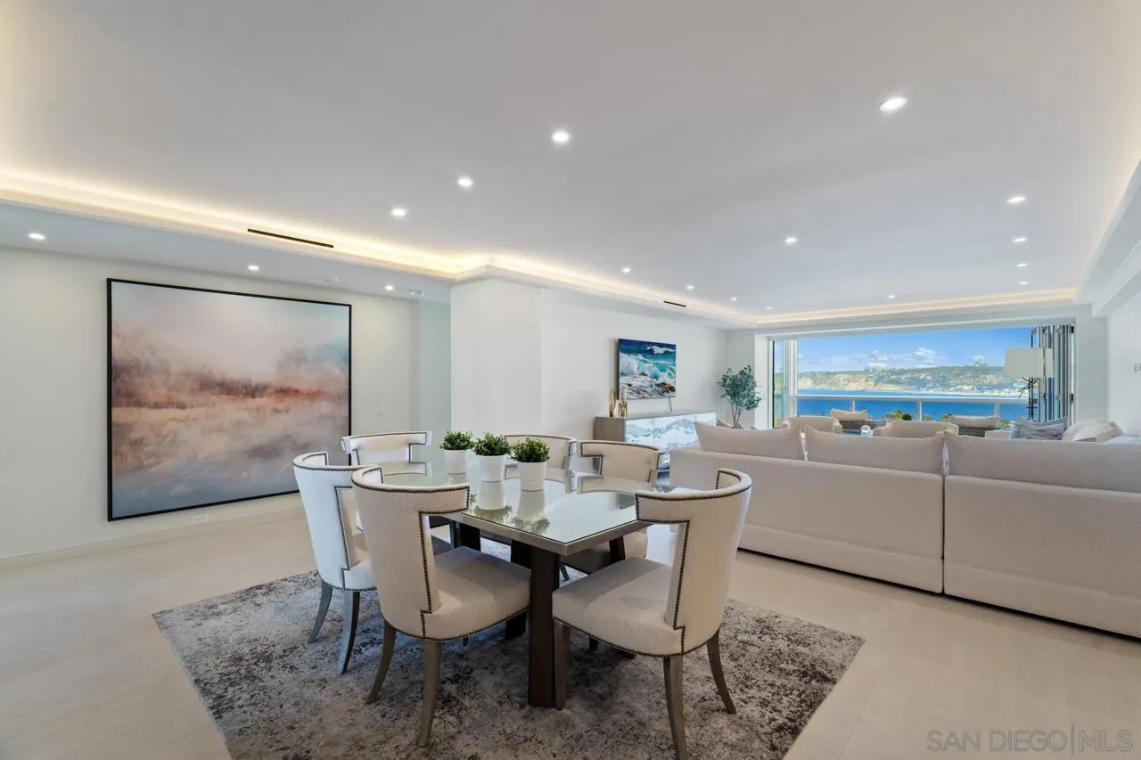 939 Coast La, Unit 16G La Jolla, CA 92037 - Photo 14 of 69 a view of a dining room with furniture wooden floor and a painting