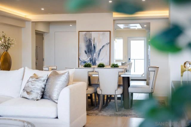 a view of a kitchen with a sink and chandelier