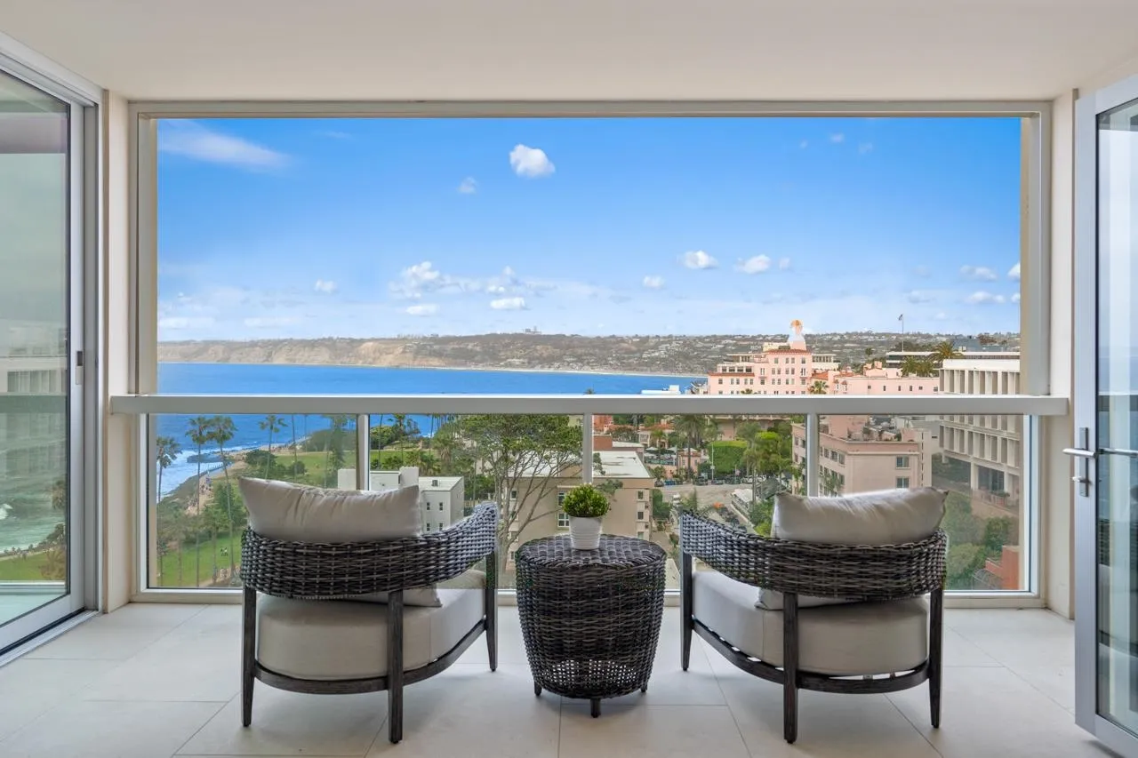 939 Coast La, Unit 16G La Jolla, CA 92037 - Photo 2 of 69 a view of a living room with furniture and a floor to ceiling window