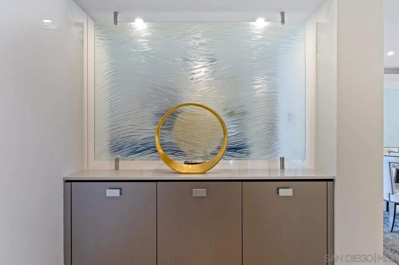 939 Coast La, Unit 16G La Jolla, CA 92037 - Photo 28 of 69 a bathroom with a sink and a mirror