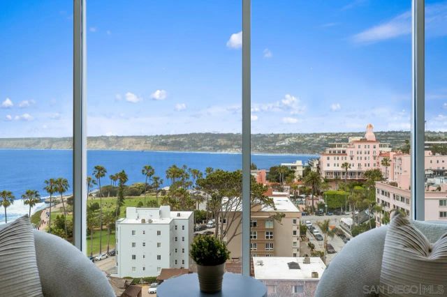 a living room with furniture and a lamp