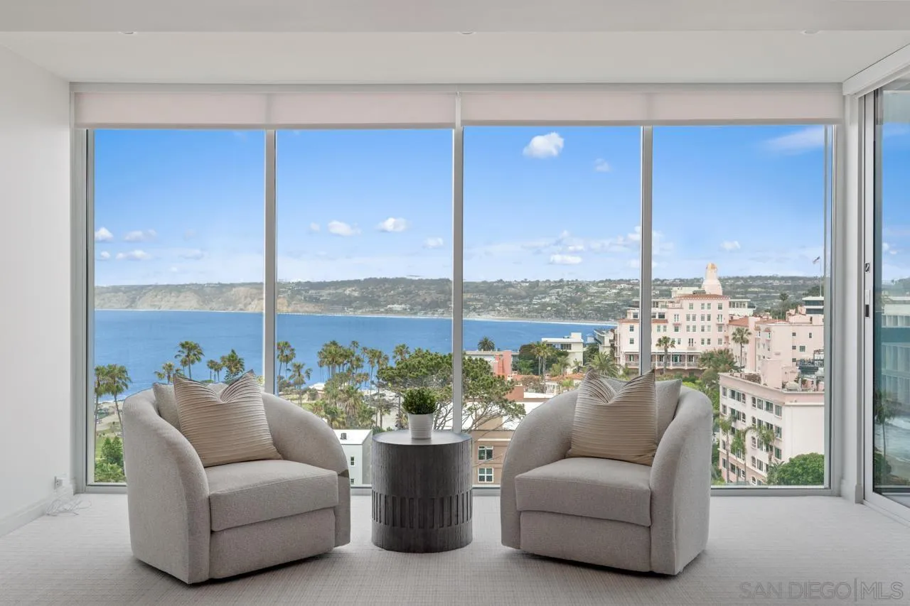 939 Coast La, Unit 16G La Jolla, CA 92037 - Photo 35 of 69 a balcony with furniture and a floor to ceiling window
