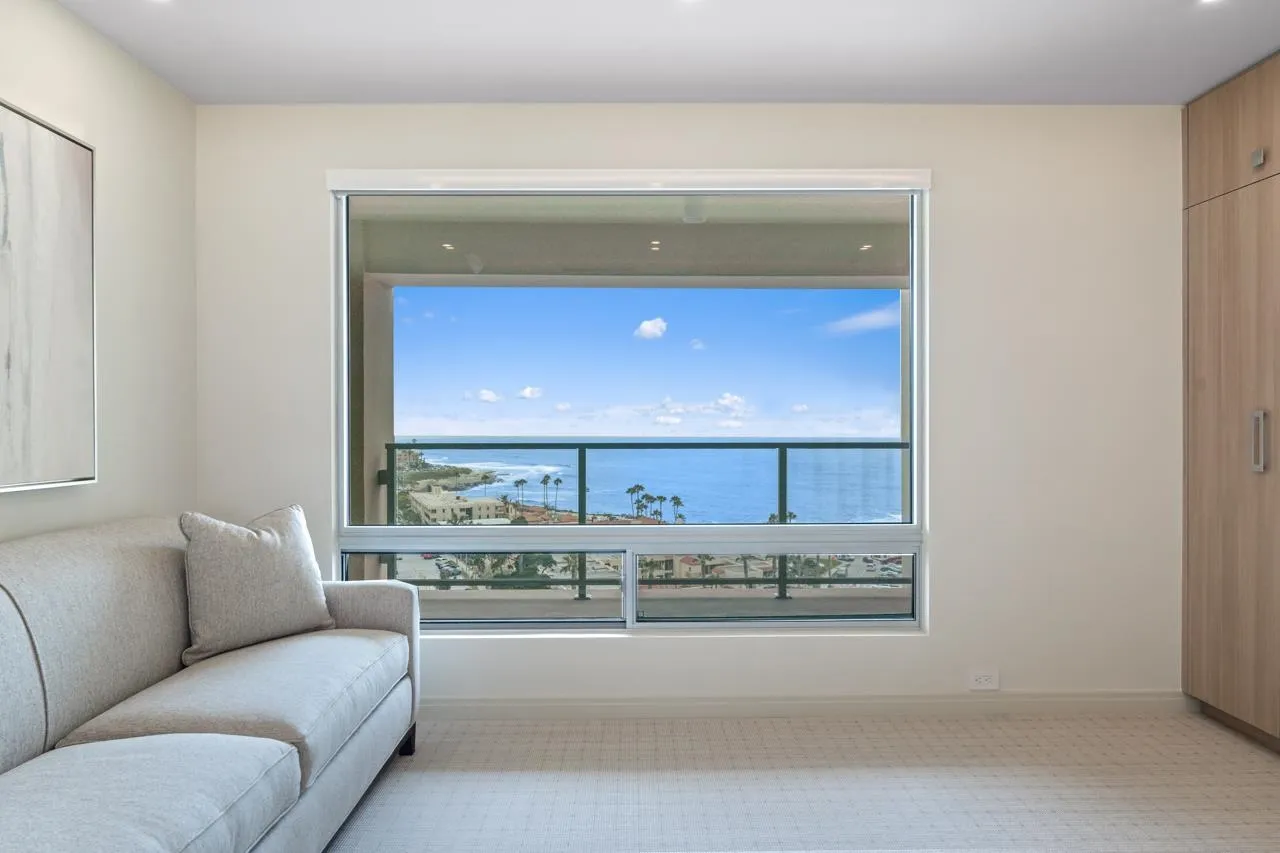 939 Coast La, Unit 16G La Jolla, CA 92037 - Photo 45 of 69 a living room with a bed furniture and a wall painting