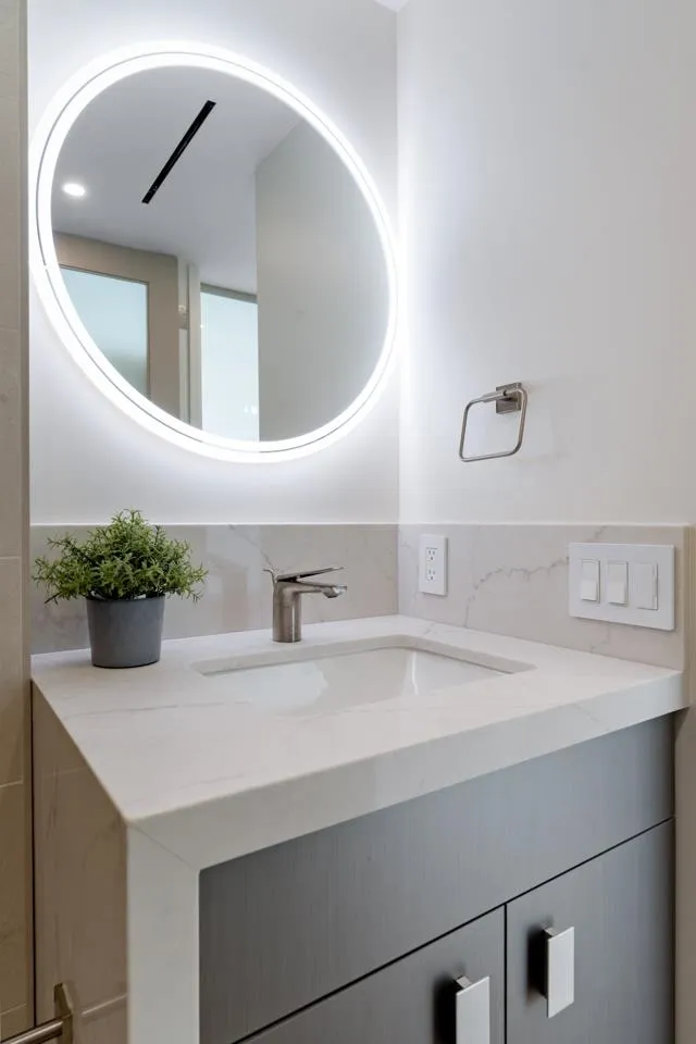 939 Coast La, Unit 16G La Jolla, CA 92037 - Photo 53 of 69 a bathroom with a sink and a mirror