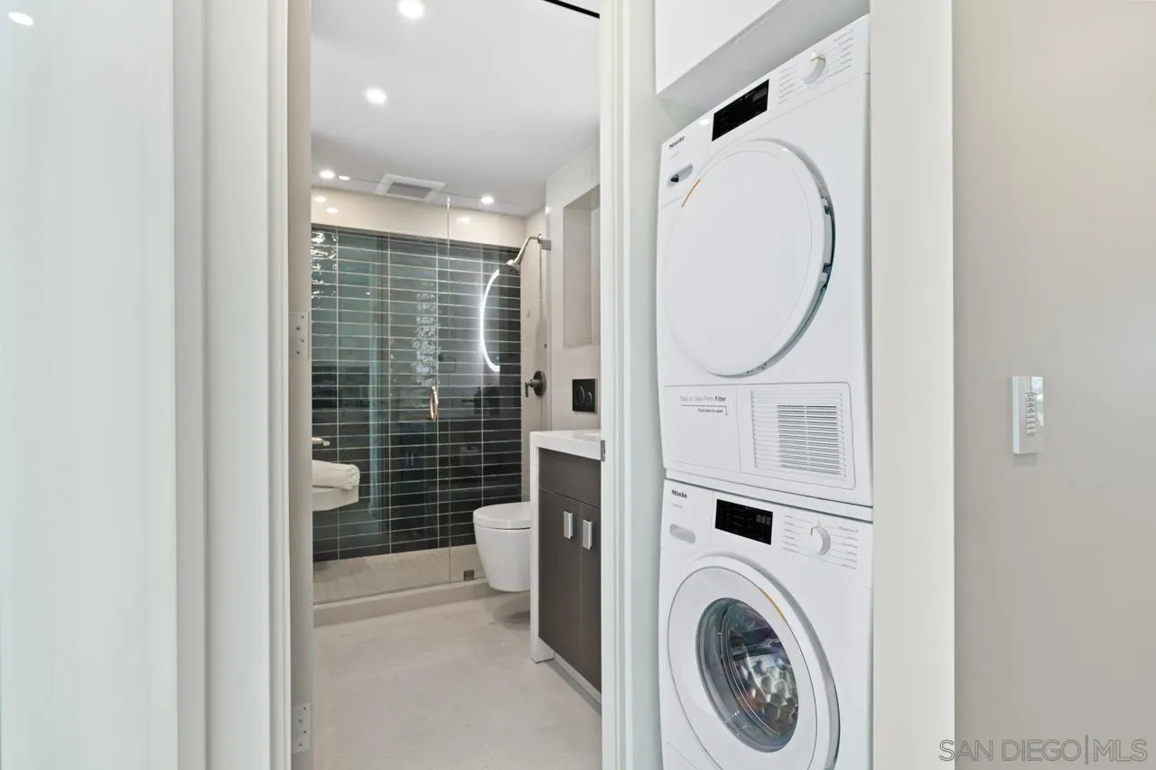 939 Coast La, Unit 16G La Jolla, CA 92037 - Photo 54 of 69 a view of a hallway with washer and dryer