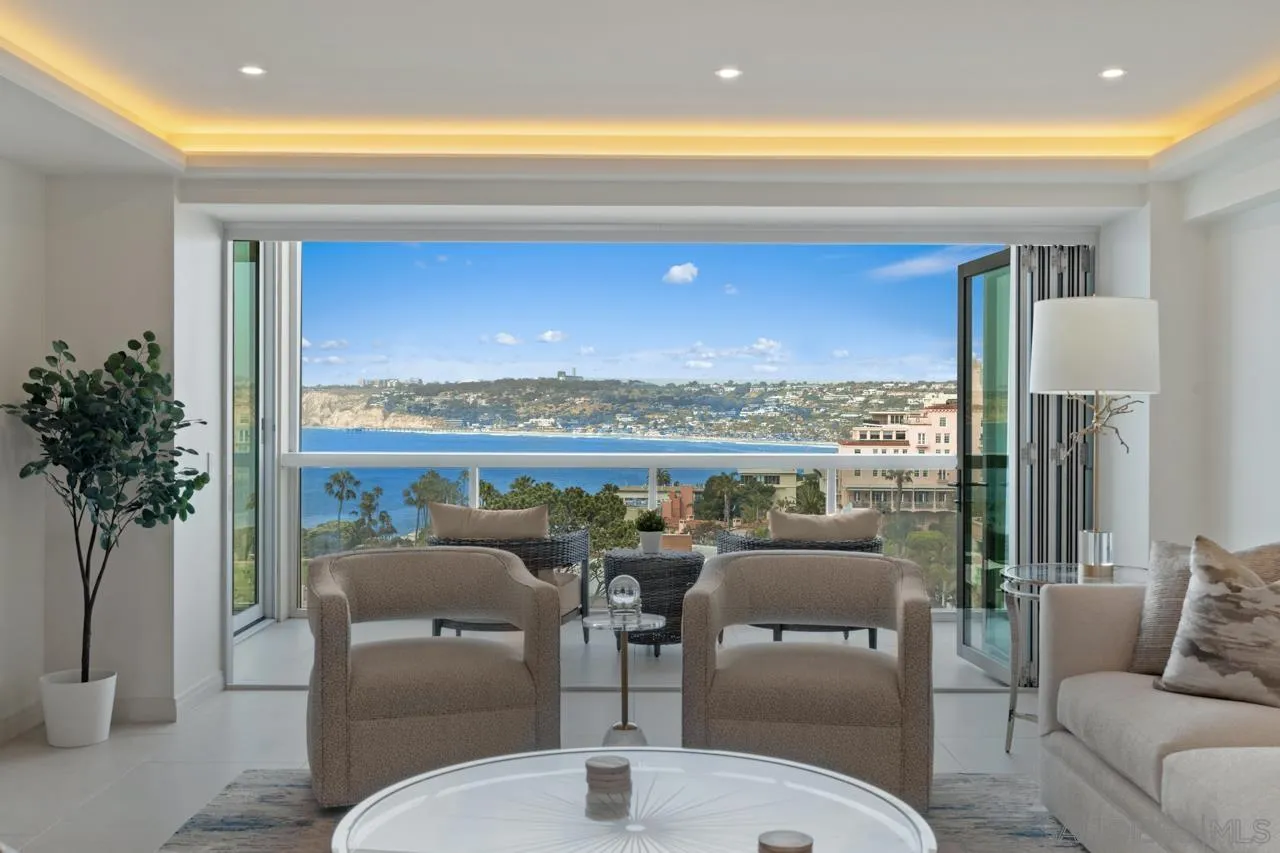 939 Coast La, Unit 16G La Jolla, CA 92037 - Photo 7 of 69 a living room with furniture and a floor to ceiling window