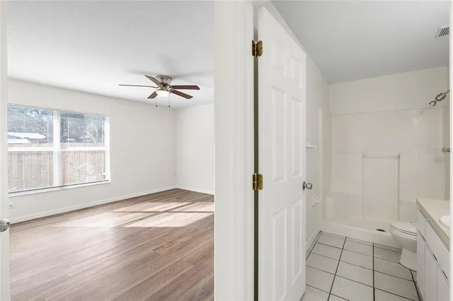 a view of an empty room with a window