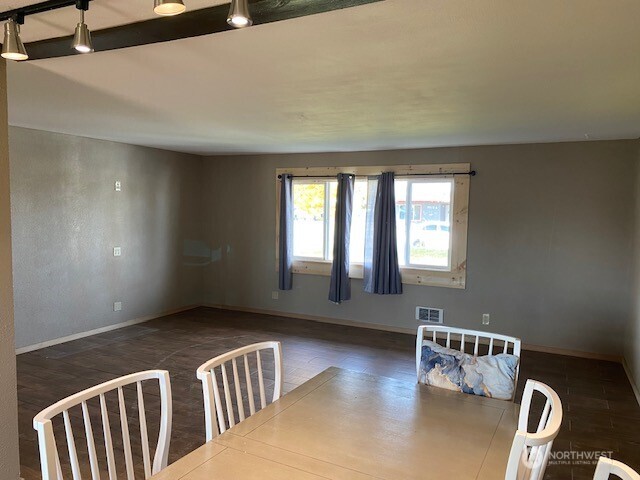 9016 Bong Loop, Unit B Moses Lake, WA 98837 - Photo 11 of 19 a living room with furniture and wooden floor