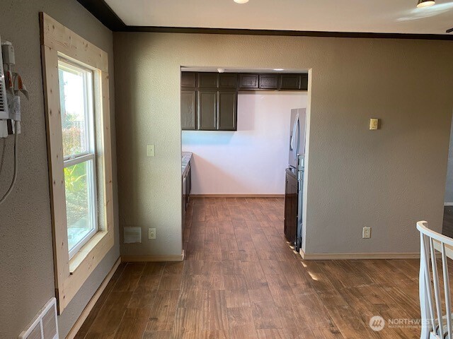 9016 Bong Loop, Unit B Moses Lake, WA 98837 - Photo 12 of 19 a view of a livingroom with wooden floor and a window