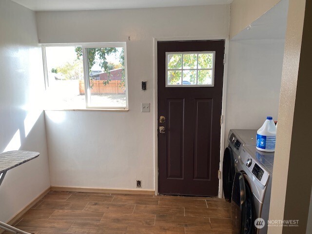 9016 Bong Loop, Unit B Moses Lake, WA 98837 - Photo 19 of 19 a view of empty room with window and wooden floor
