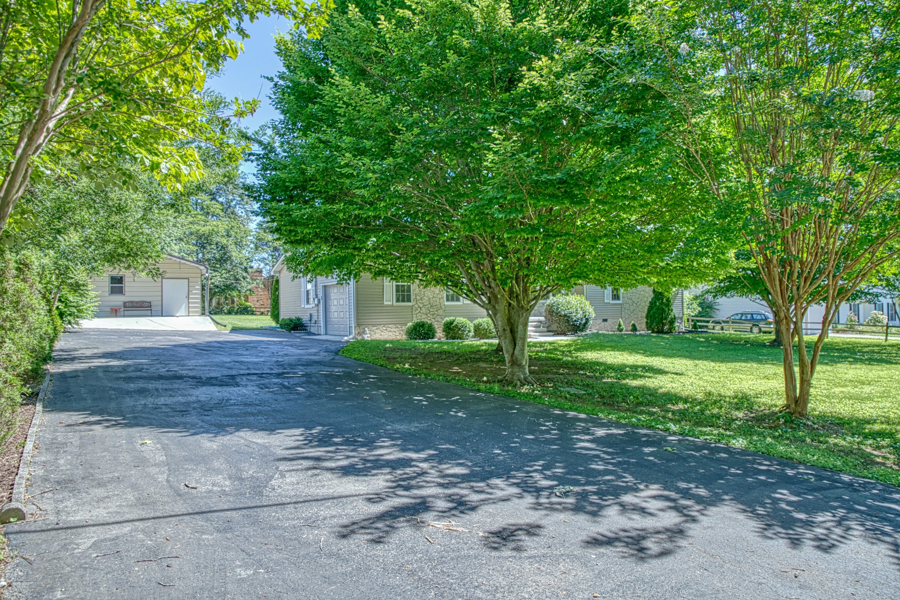 2085 Herbert Garrett Road Cookeville, TN 38506 - Photo 3 of 39 a view of a yard with plants and trees