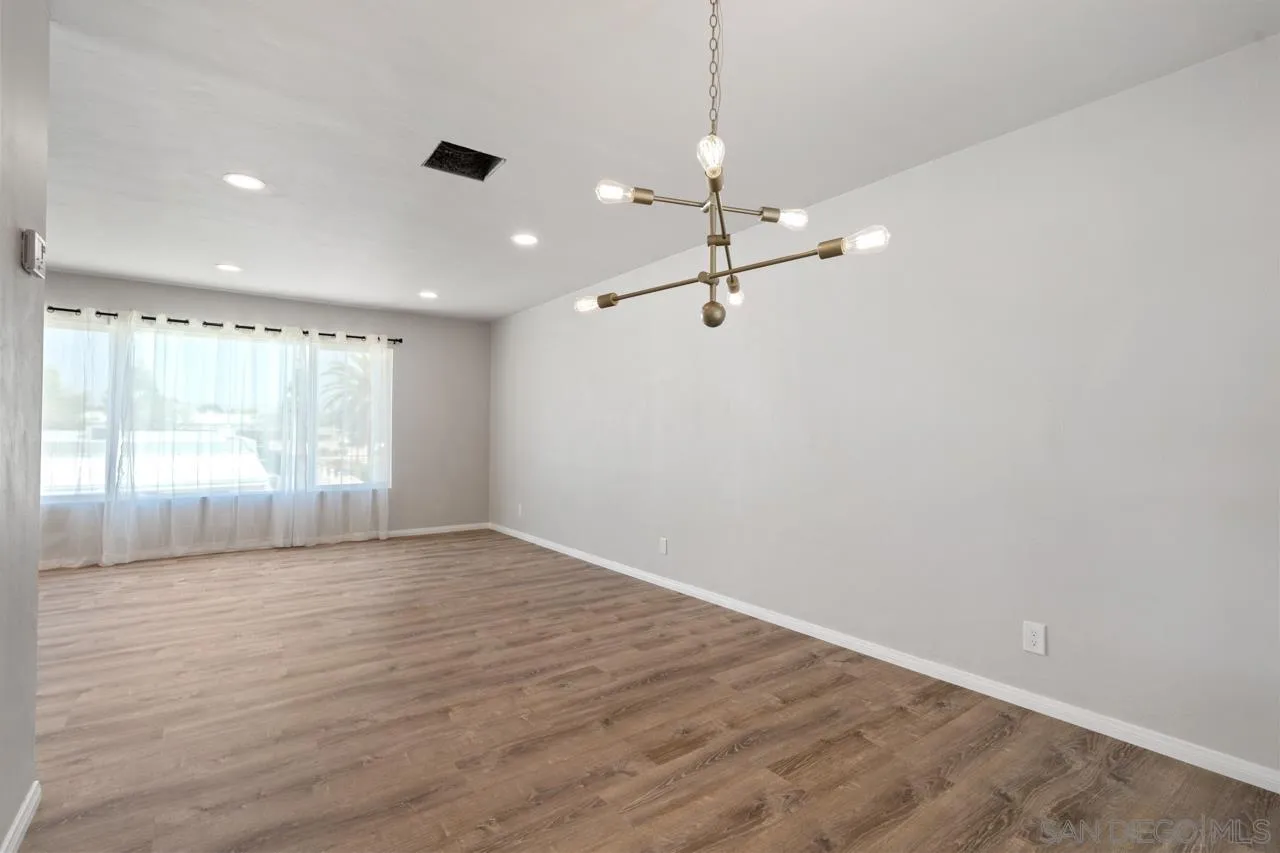 3276-3282 Main Street Lemon Grove, CA 91945 - Photo 17 of 75 an empty room with wooden floor cabinet and windows