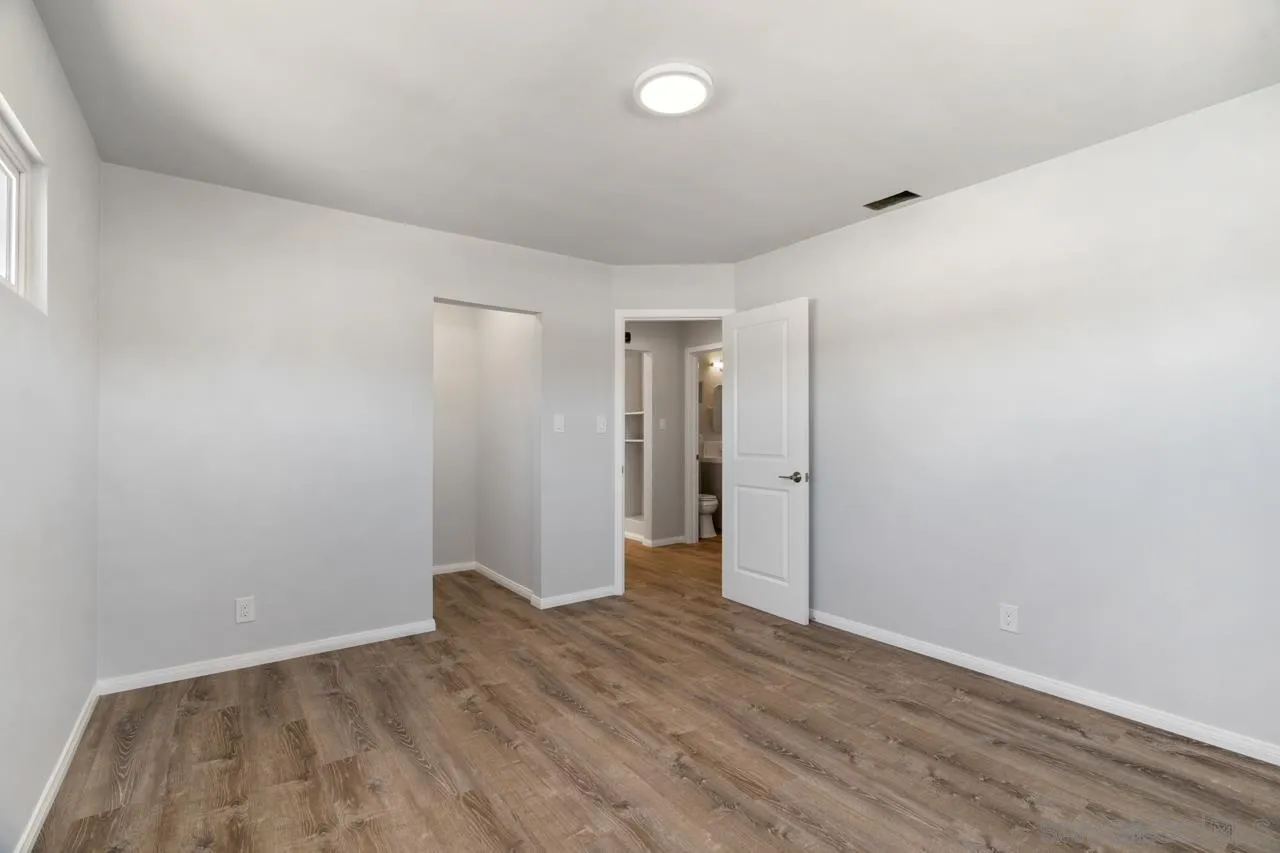 3276-3282 Main Street Lemon Grove, CA 91945 - Photo 20 of 75 a view of an empty room with wooden floor and closet
