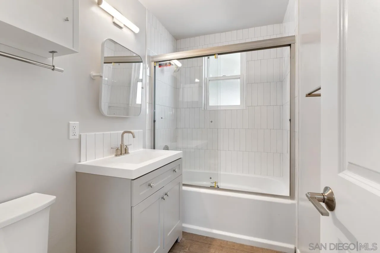 3276-3282 Main Street Lemon Grove, CA 91945 - Photo 26 of 75 a bathroom with a shower sink vanity and toilet