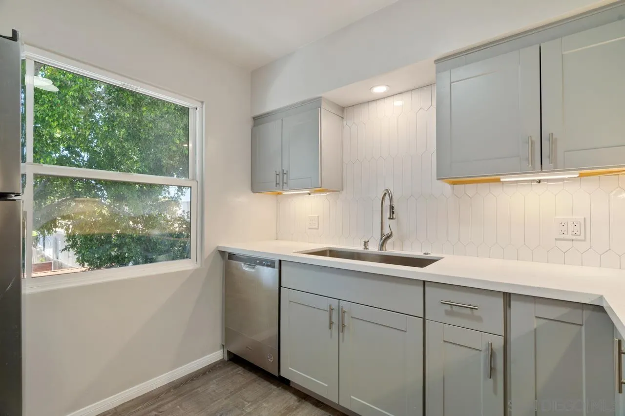 3276-3282 Main Street Lemon Grove, CA 91945 - Photo 5 of 75 a kitchen with a sink window and cabinets