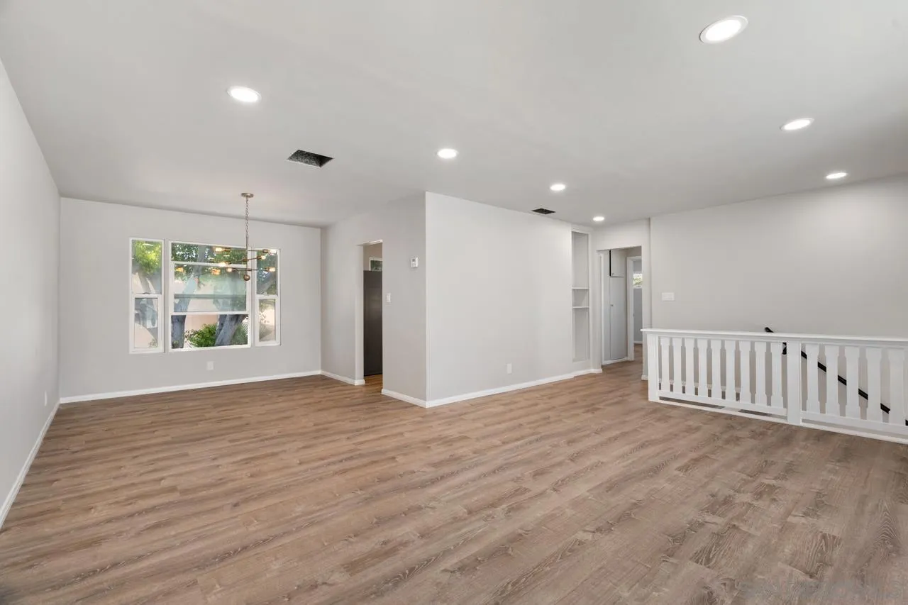 3276-3282 Main Street Lemon Grove, CA 91945 - Photo 8 of 75 a view of an empty room with wooden floor and a window