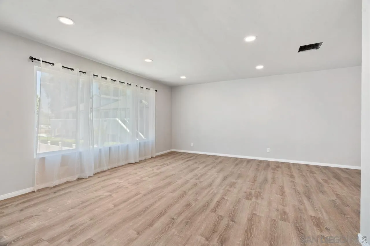 3276-3282 Main Street Lemon Grove, CA 91945 - Photo 9 of 75 wooden floor in an empty room with a window