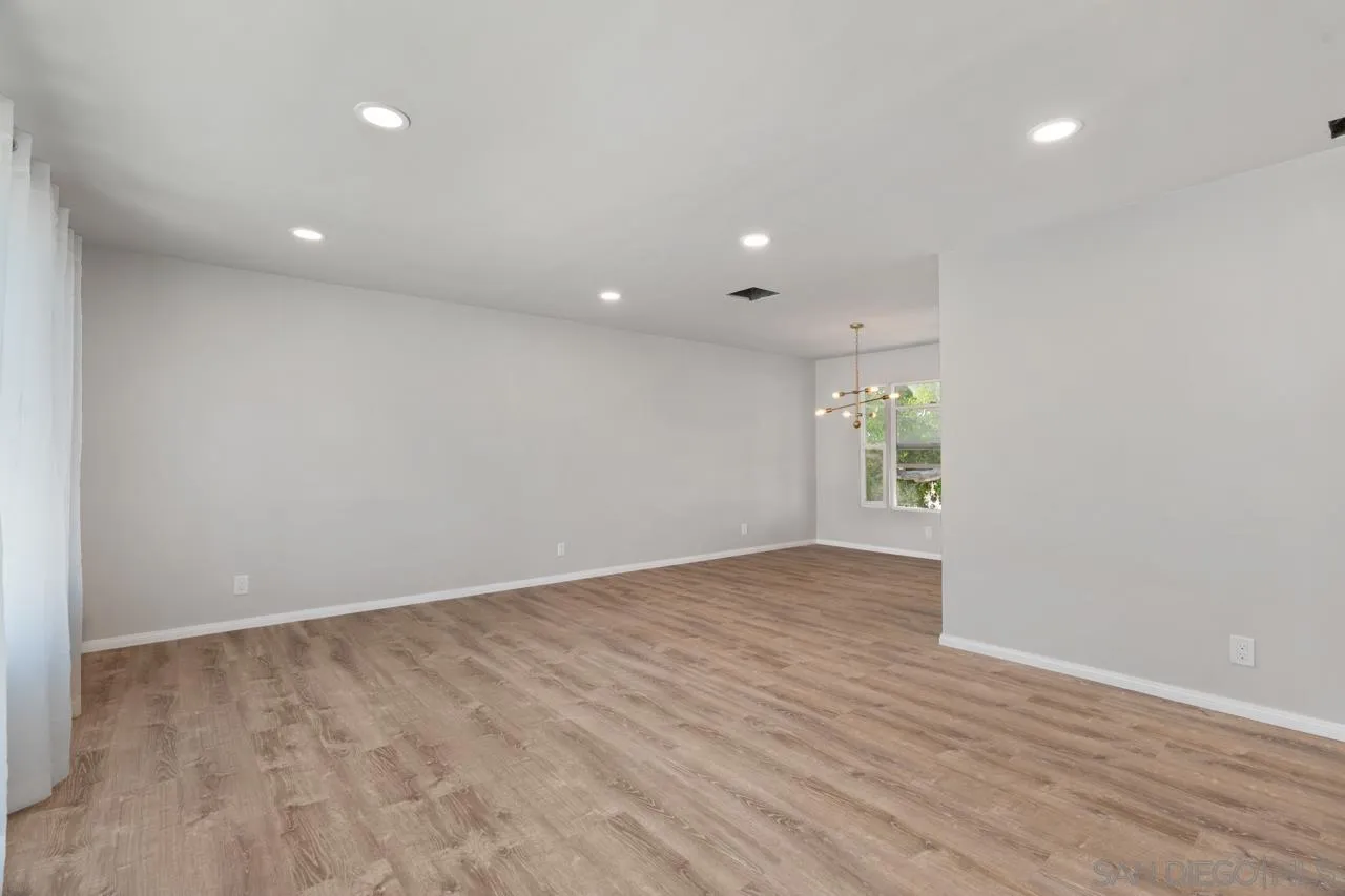 3276-3282 Main Street Lemon Grove, CA 91945 - Photo 10 of 75 an empty room with wooden floor and windows