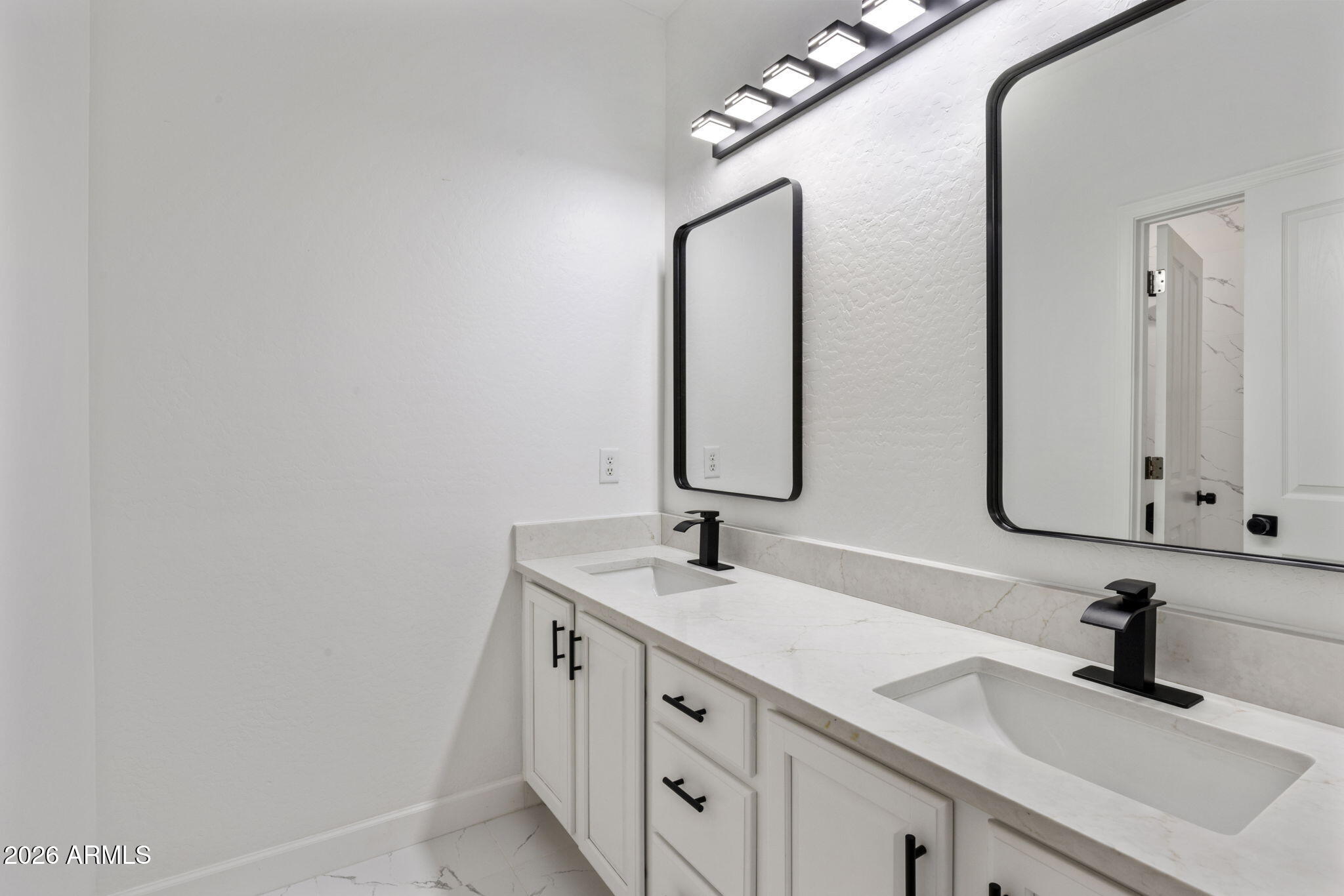 5121 West Beverly Road Laveen, AZ 85339 - Photo 25 of 32 a bathroom with a sink and a mirror