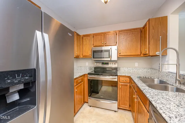 a view of an empty room and wooden floor