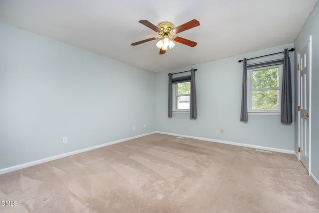 a kitchen with granite countertop a sink a stove and cabinets
