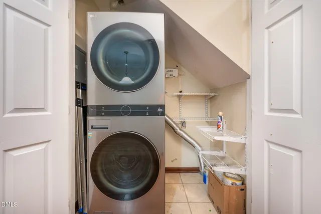 a view of an empty room with a ceiling fan