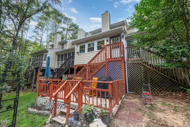 a balcony with wooden floor and city view