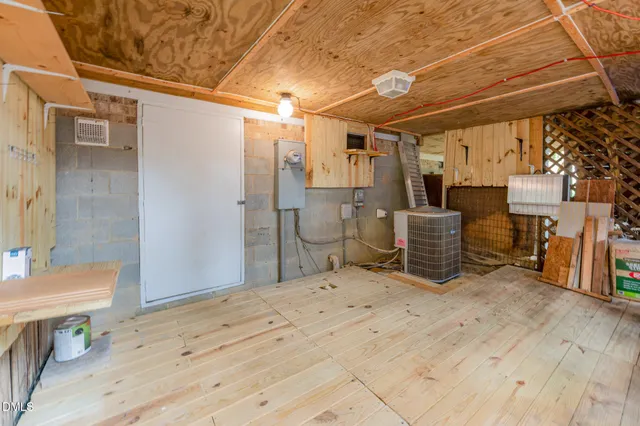 a view of deck with chairs and wooden fence