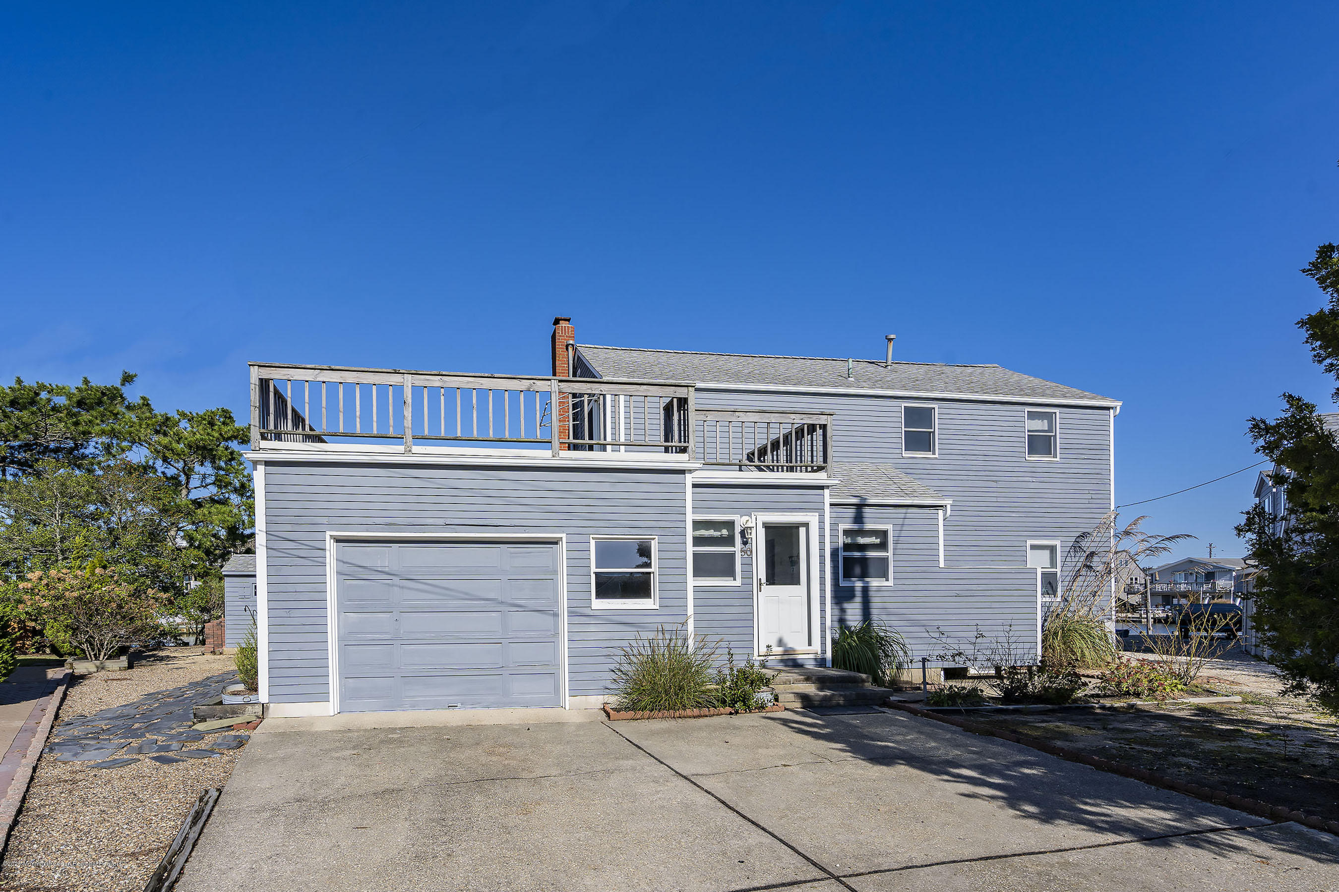 50 Amherst Road Barnegat Light, NJ 08006 - Photo 14 of 34 a front view of a house with a garage