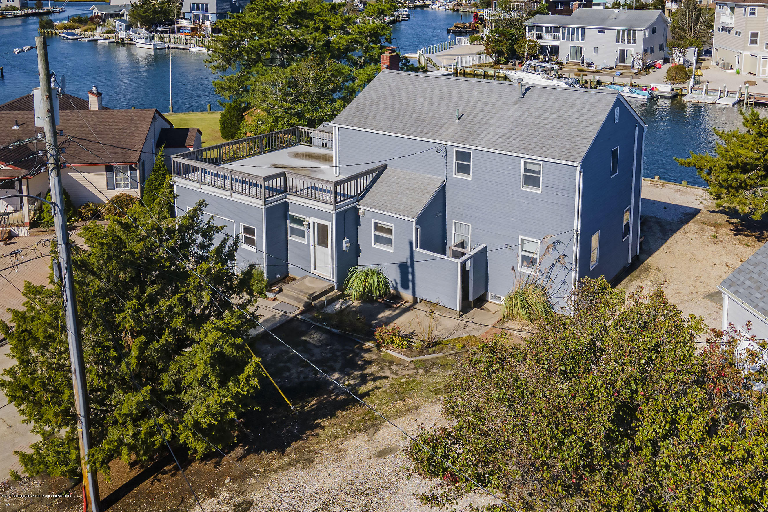 50 Amherst Road Barnegat Light, NJ 08006 - Photo 18 of 34 an aerial view of a house with a yard and potted plants