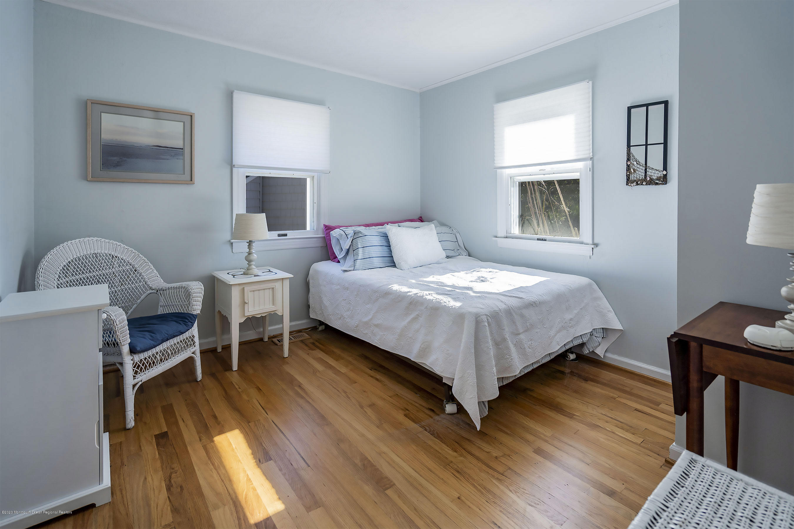 50 Amherst Road Barnegat Light, NJ 08006 - Photo 3 of 34 a bedroom with a bed wooden floor and a window
