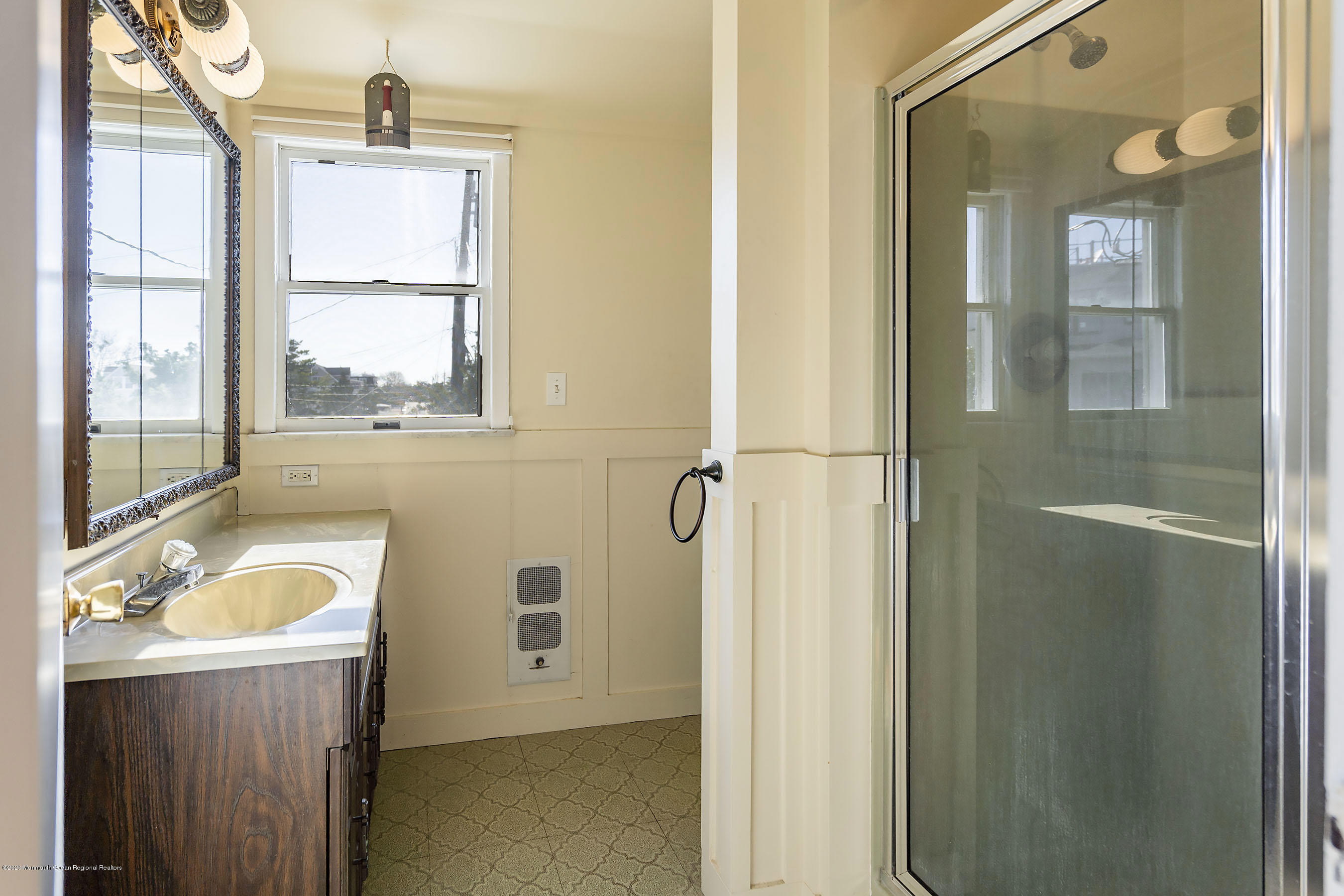 50 Amherst Road Barnegat Light, NJ 08006 - Photo 23 of 34 a bathroom with a tub a sink and a window