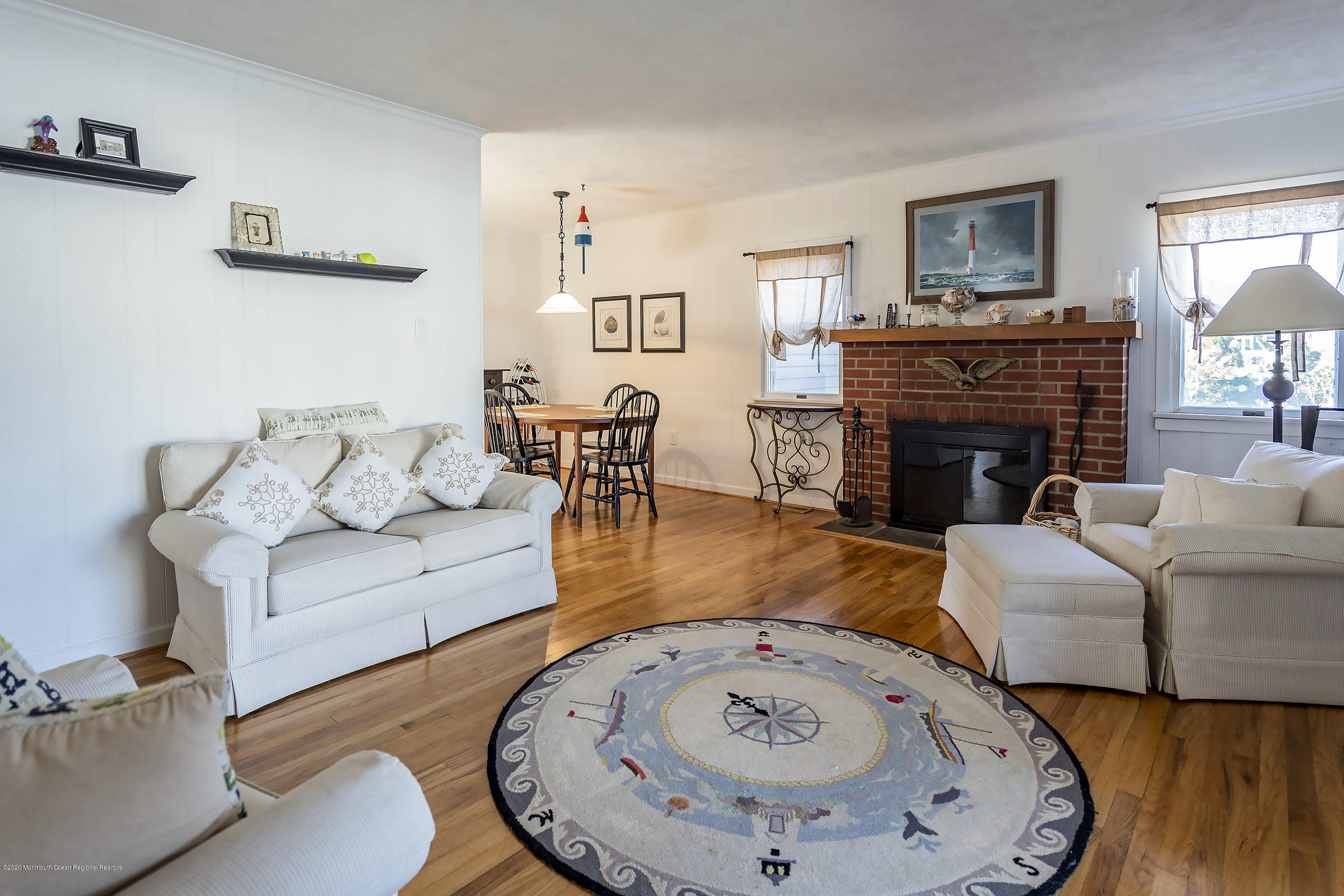 50 Amherst Road Barnegat Light, NJ 08006 - Photo 28 of 34 a living room with furniture a fireplace and wooden floor