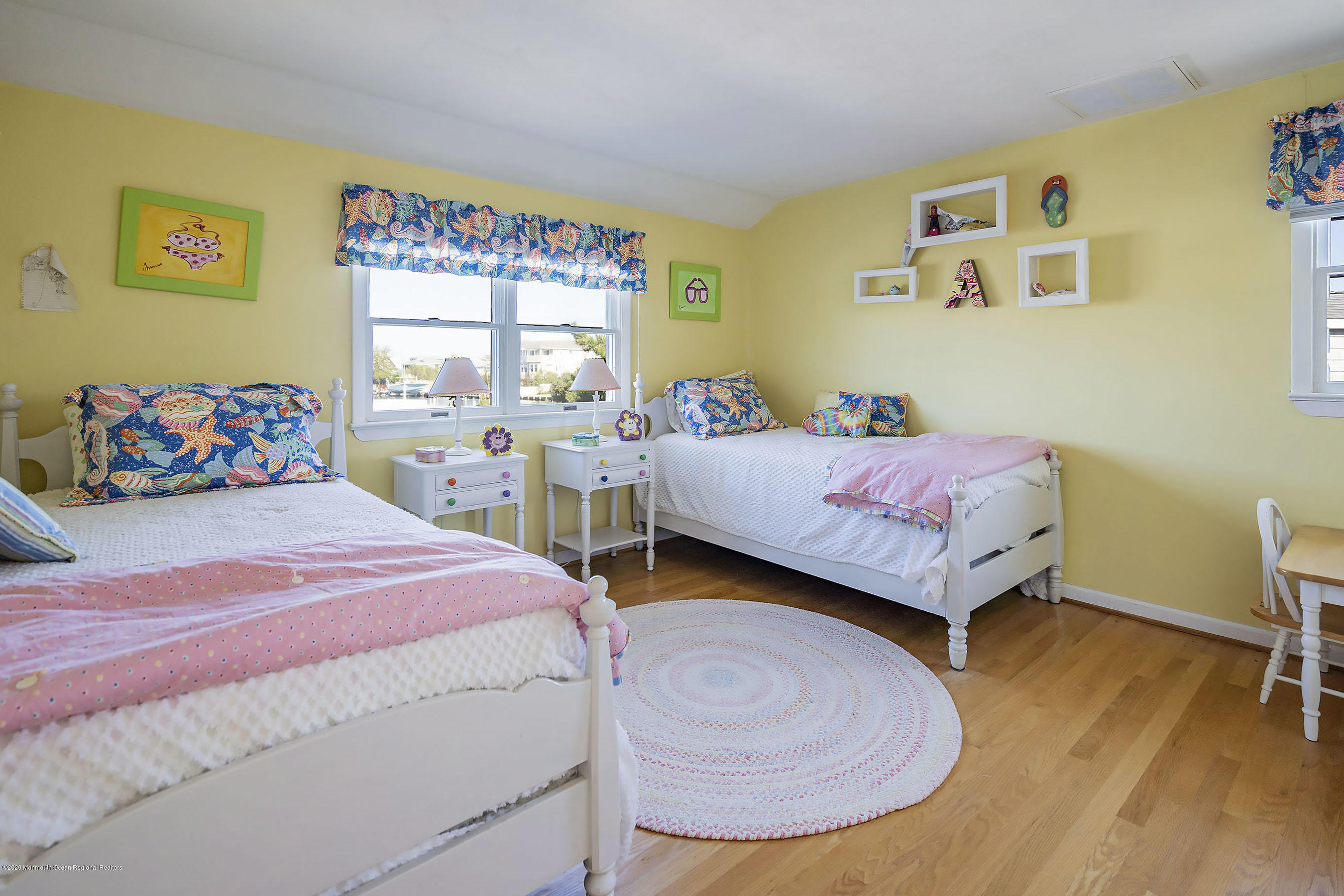 50 Amherst Road Barnegat Light, NJ 08006 - Photo 4 of 34 a bedroom with a bed and wooden floor