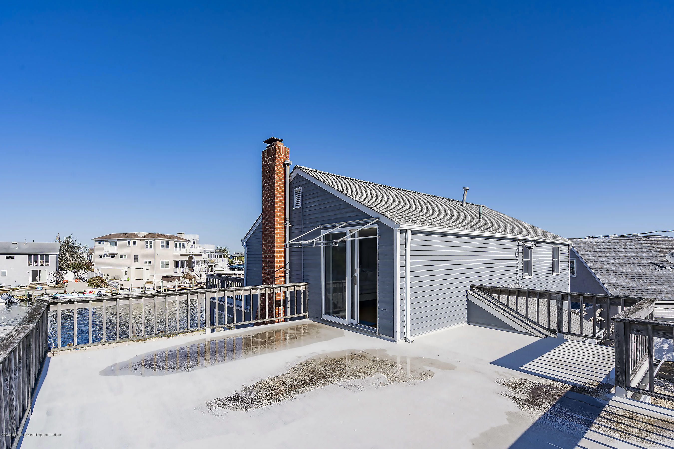 50 Amherst Road Barnegat Light, NJ 08006 - Photo 34 of 34 a balcony with table and chairs