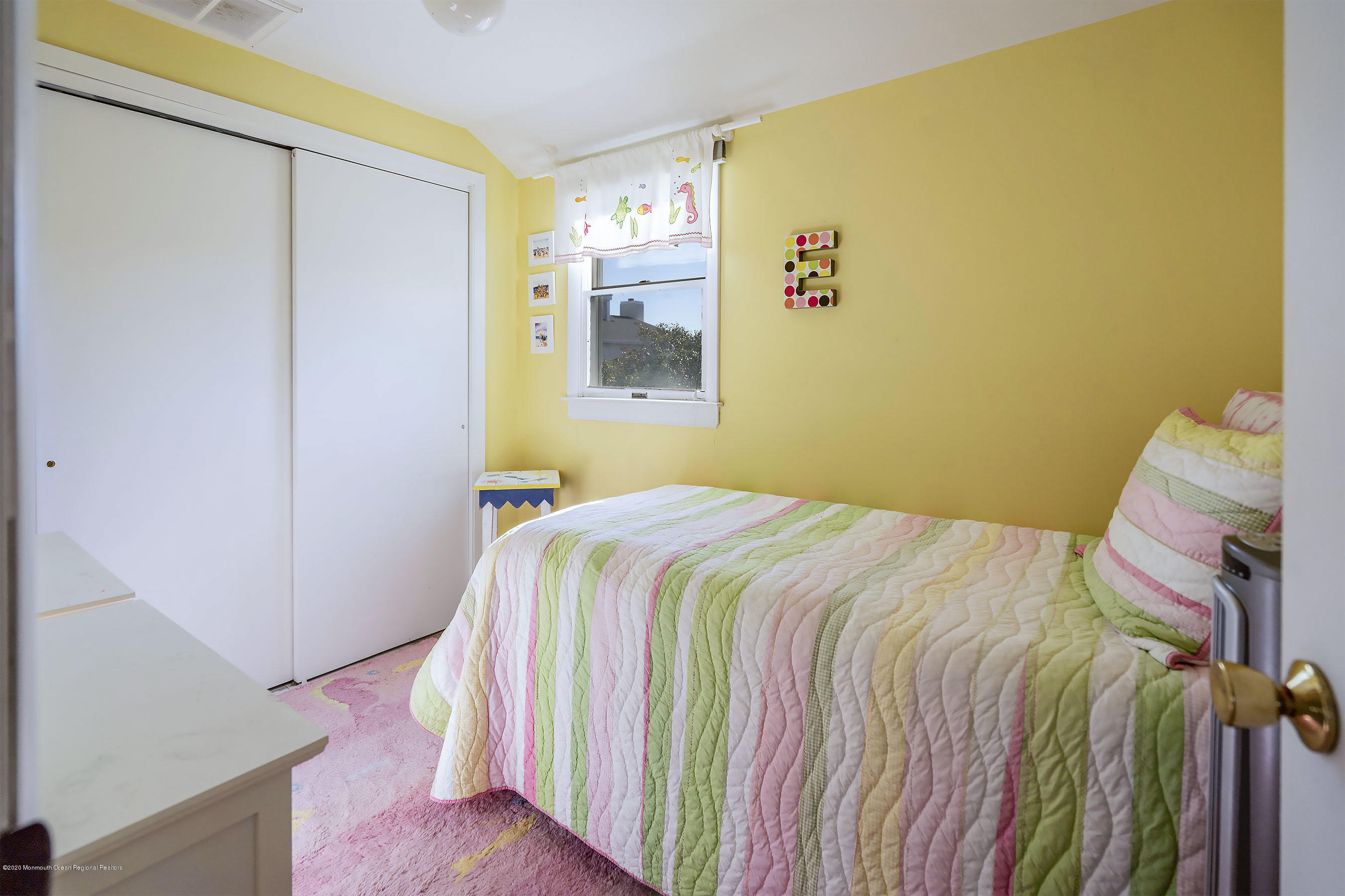 50 Amherst Road Barnegat Light, NJ 08006 - Photo 5 of 34 a bedroom with a bed and a wall painting