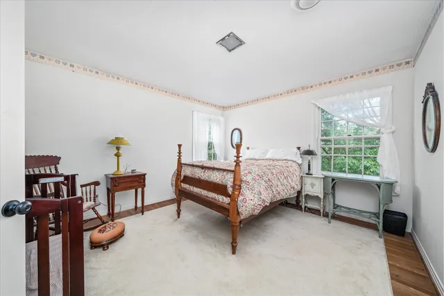 a bedroom with furniture and a bed