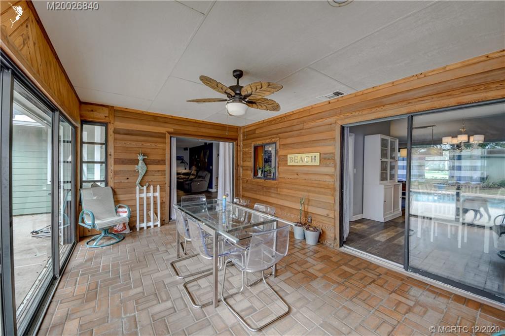 1654 Southwest 85th Terrace Stuart, FL 34997 - Photo 24 of 48 a view of a hall with wooden floor and a rug