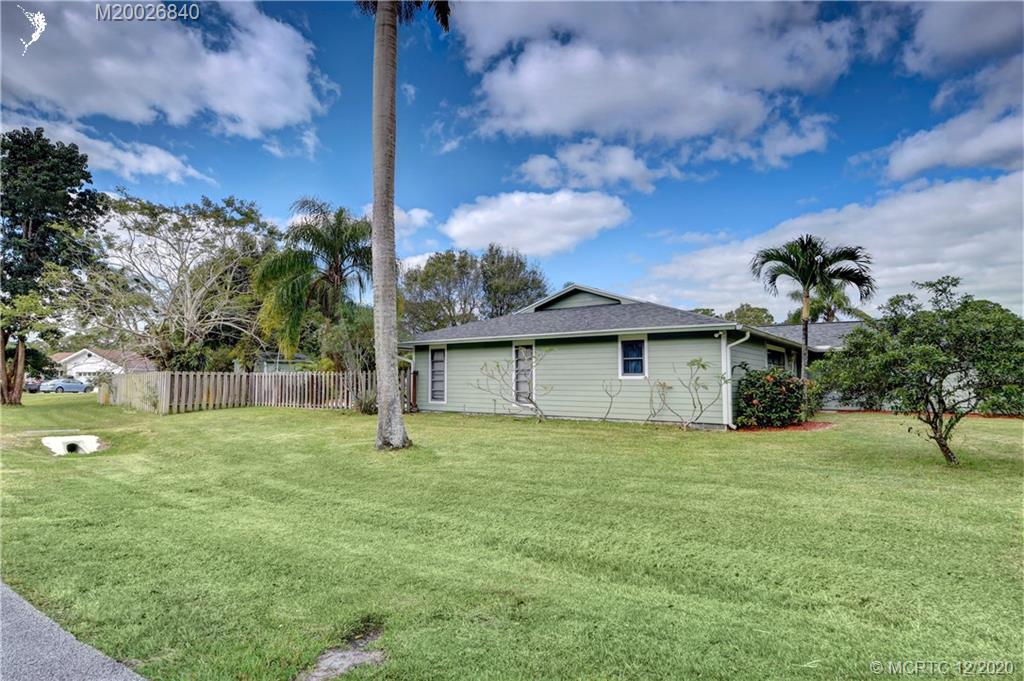 1654 Southwest 85th Terrace Stuart, FL 34997 - Photo 3 of 48 a house with garden in front of it