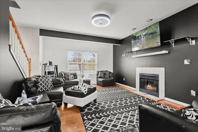 a bedroom with furniture and a fireplace