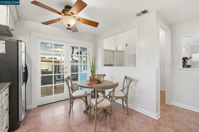a dining room with furniture and window