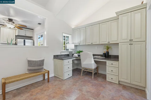 a spacious bedroom with a bed and a window