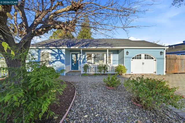 a front view of a house with garden