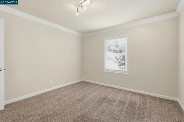 a bathroom with a granite countertop sink a mirror and a shower