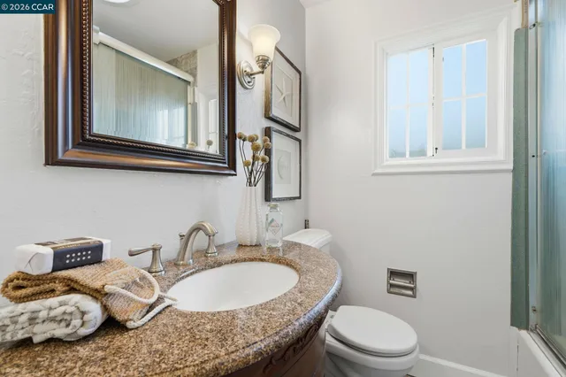 a view of a patio with table and chairs and wooden floor